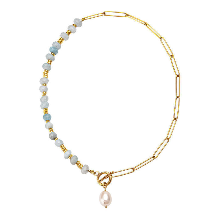 Zoé – Lange goldene Ohrringe mit Perlenanhänger.