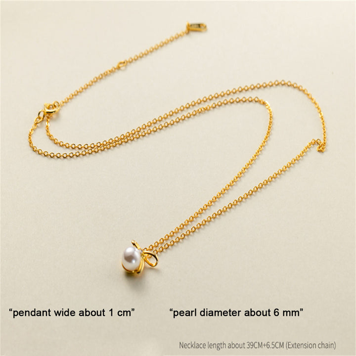 Johanna-Luisa – Goldene Ohrringe mit doppelter Perle.